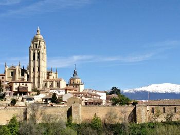 Low angle view of built structures against blue sky