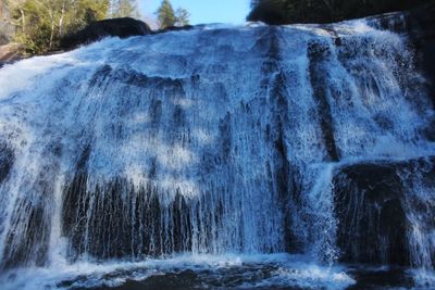 Close-up of waterfall against sky