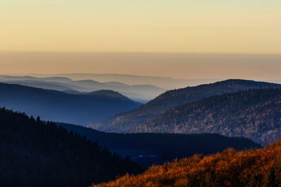 Scenic view of mountains against sky at sunset