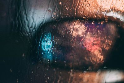 Full frame shot of wet glass window in rainy season