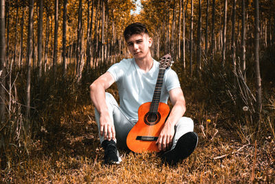 Portrait of man playing guitar