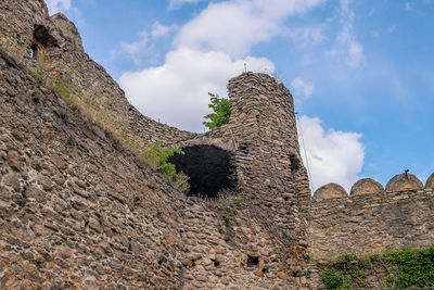 Low angle view of old ruins against sky