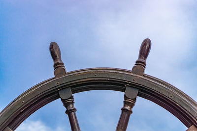 Low angle view of metallic structure against sky