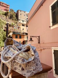 Bag on building against sky in city