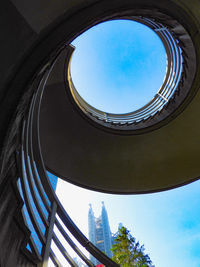Low angle view of spiral staircase against sky