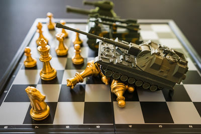 Close-up of chess pieces on table