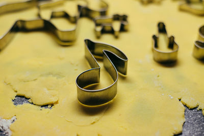 Cookie cutter on top of the dough in the shape of a note