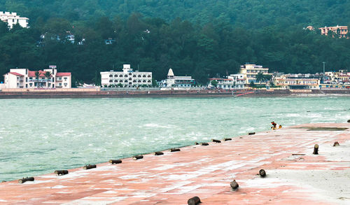 Pier by river in city