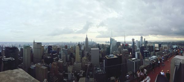 Panoramic view of modern buildings in city against sky