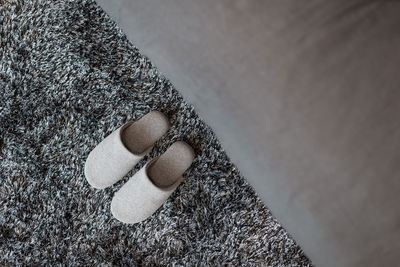 Directly above shot of slippers on rug