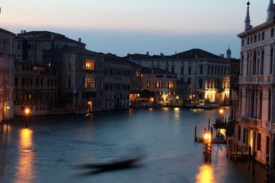 Illuminated buildings in city at night