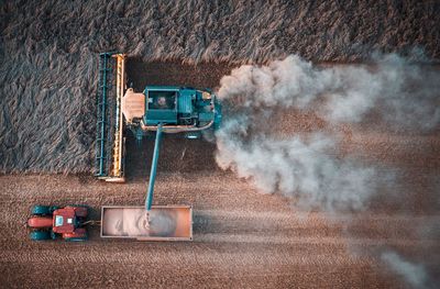 Aerial view of combine harvester in farm