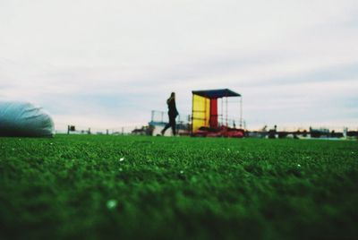 Men on field against sky