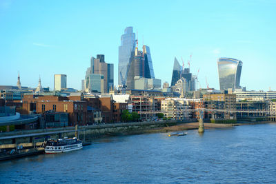 London city skyline and river thames viewed from blackfriars station. afternoon with clear blue sky.