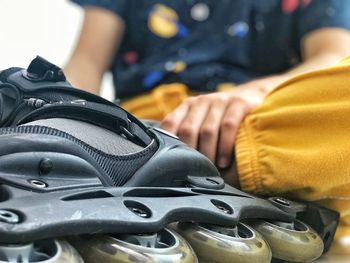 Low section of boy wearing inline skate