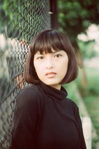 Portrait of beautiful young woman standing outdoors