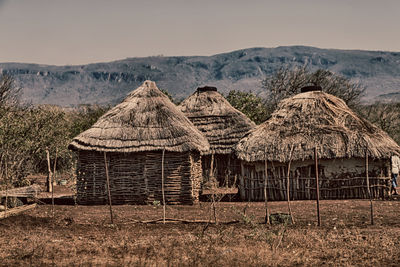 Panoramic view of building and mountains against sky