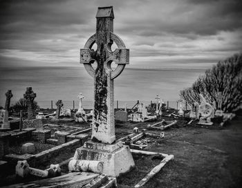 Crosses at cemetery against the sky