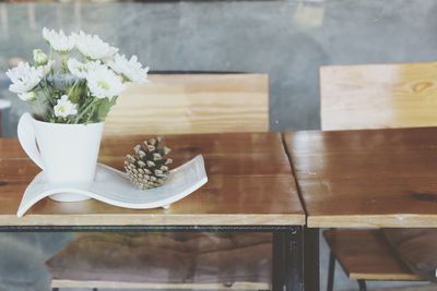 White flower pot on table