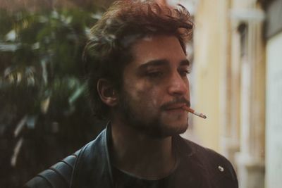 Close-up of man smoking cigarette