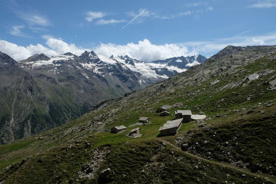 Scenic view of snowcapped mountains against sky