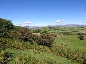 Scenic view of mountain against blue sky