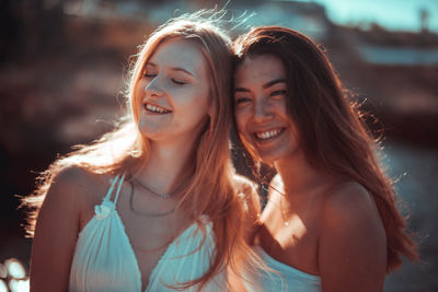 Close-up of smiling young female friends