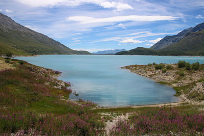 Scenic view of lake of mont cenis and alps mountains against sky