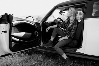 Portrait of woman sitting in car