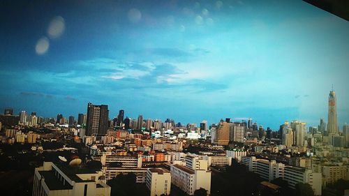 Modern cityscape against blue sky