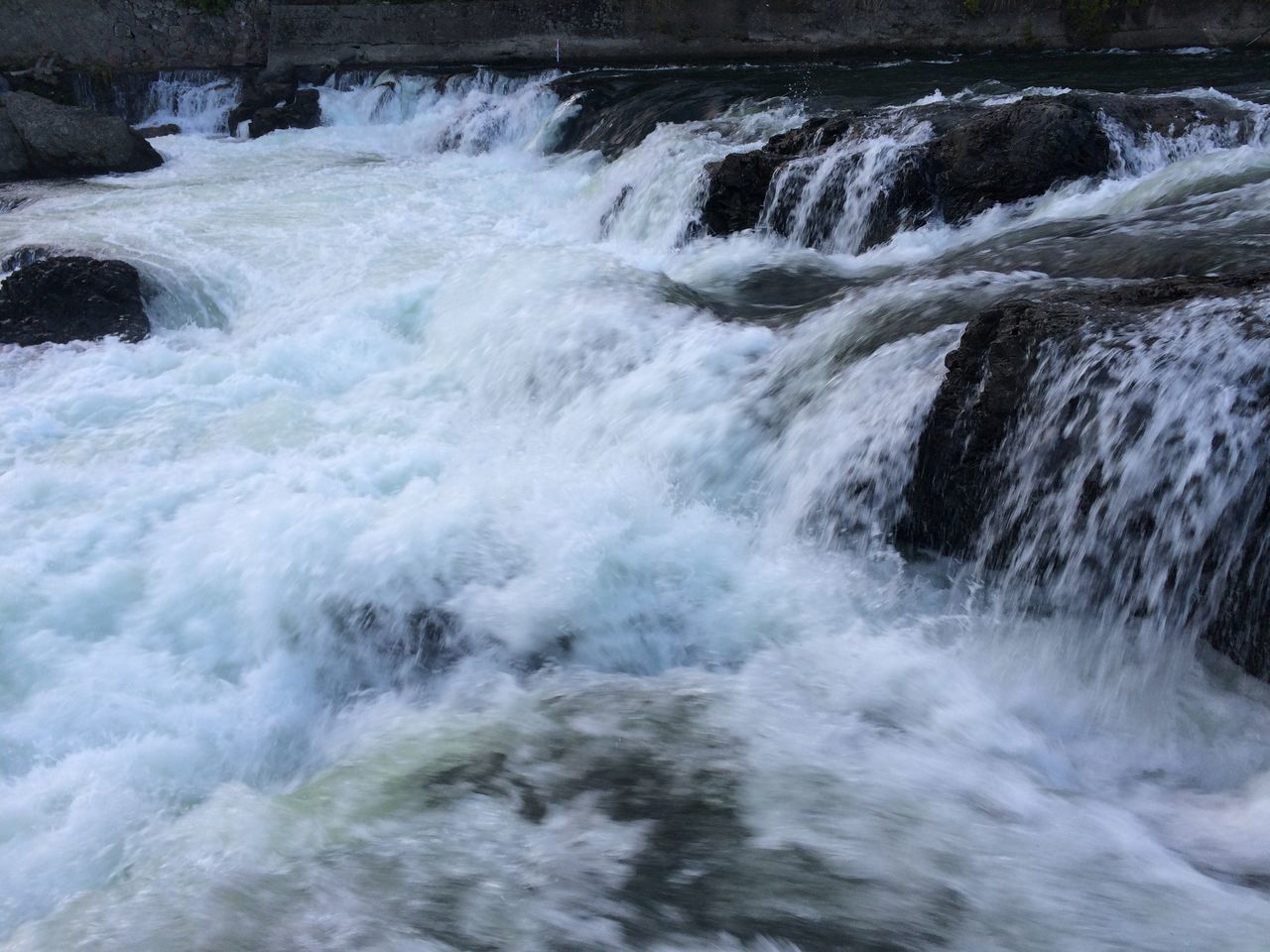 water, surf, motion, flowing water, wave, beauty in nature, nature, waterfall, splashing, long exposure, power in nature, scenics, flowing, rock - object, sea, day, high angle view, outdoors, river, no people