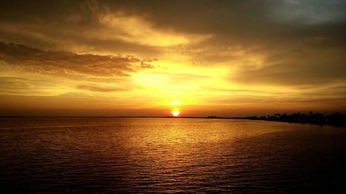 Scenic view of sea at sunset