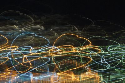 Close-up of illuminated lighting against sky at night