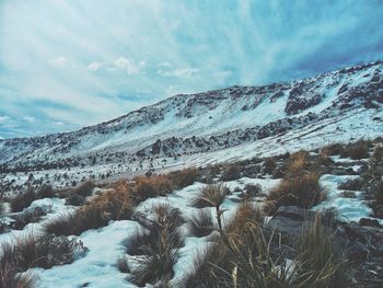 Scenic view of snowcapped mountains against sky