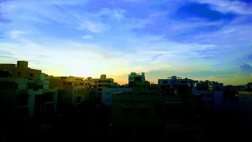 Cityscape against sky during sunset