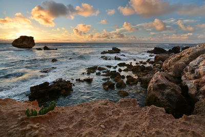 Scenic view of sea against sky during sunset