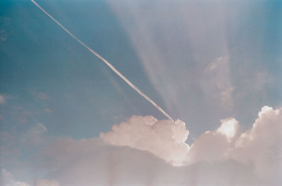 Low angle view of vapor trails in sky