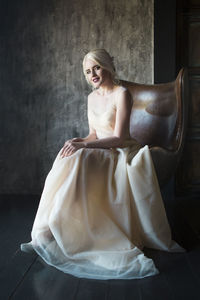 Portrait of bride sitting on chair