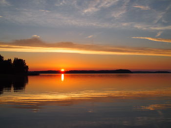 Scenic view of sea against orange sky