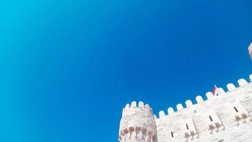 Low angle view of building against blue sky