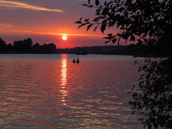 Scenic view of sea against orange sky