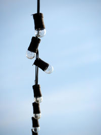 Low angle view of lamp post against blue sky