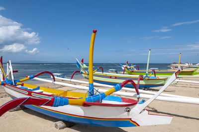 Boats in sea against sky