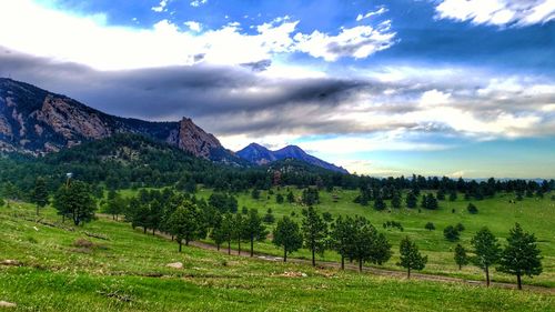 Scenic view of landscape and mountains against sky