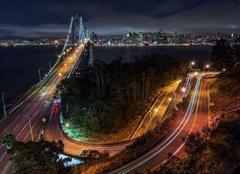 Aerial view of illuminated yerba buena island against sky at night