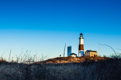 Lighthouse against clear blue sky