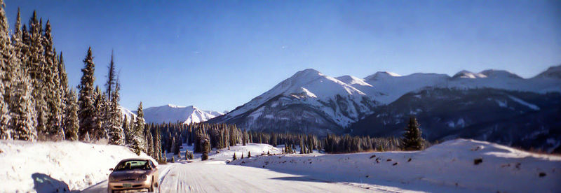 Panoramic view of snowcapped mountains against sky