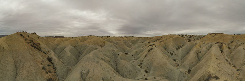 Panoramic view of rocky mountains against sky