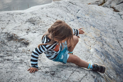 Full length of woman on rock