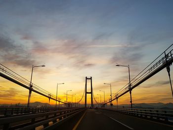 Low angle view of bridge against sky during sunset